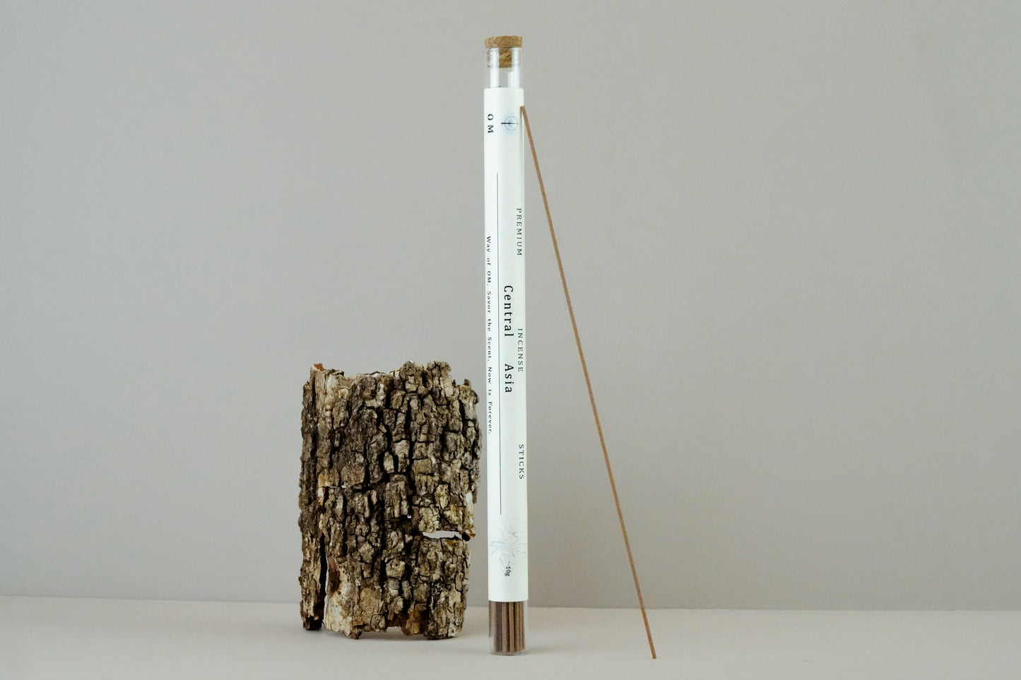 Incense tube standing upright on wooden base – OM Central Asia scent inspired by ancient trade routes