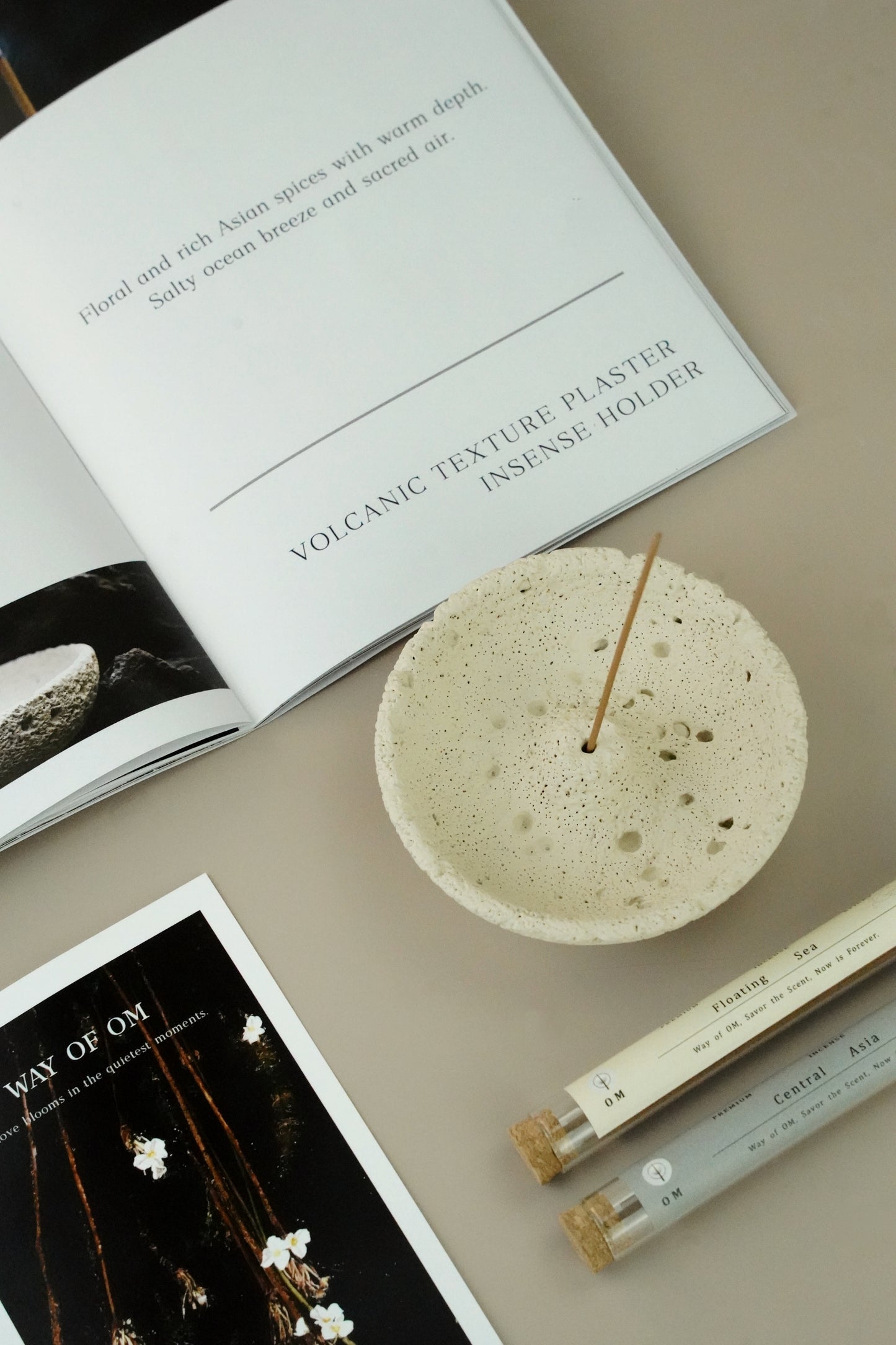OM incense set flat lay with cream white plaster holder, incense sticks and packaging card