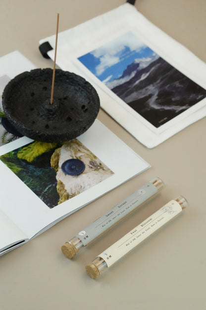 Pear Blossom and Sweet Escape incense sticks with black plaster holder on white table – OM natural scent set