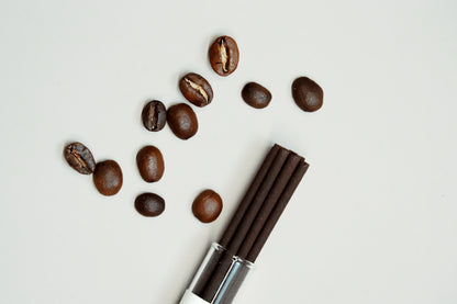Brazilian coffee beans with incense tubes – OM roasted coffee incense aesthetic